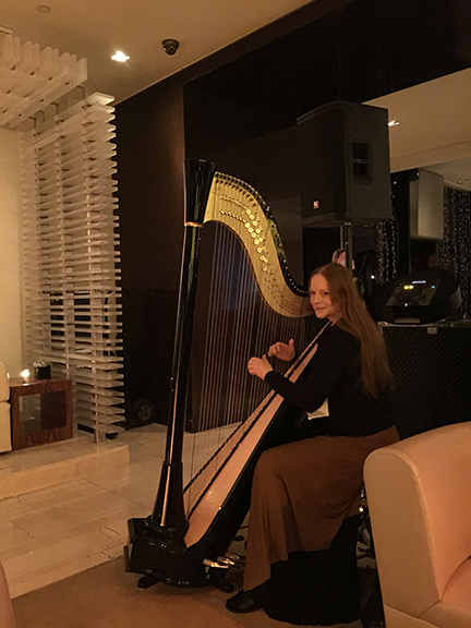 Erin at the W Hotel in Times Square playing her harp